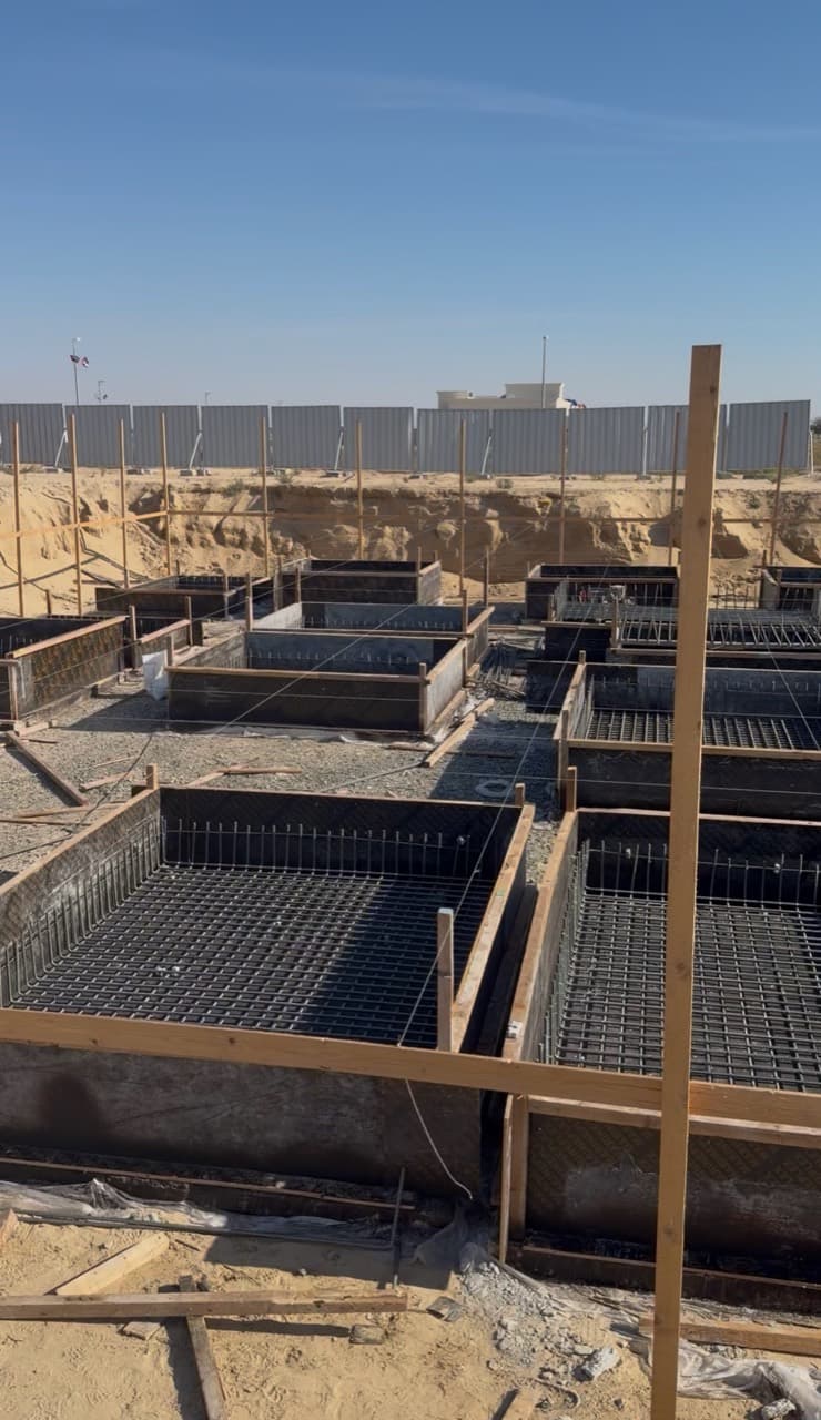 Owner-supplied site preparation photograph showing reinforcement grids and shuttering